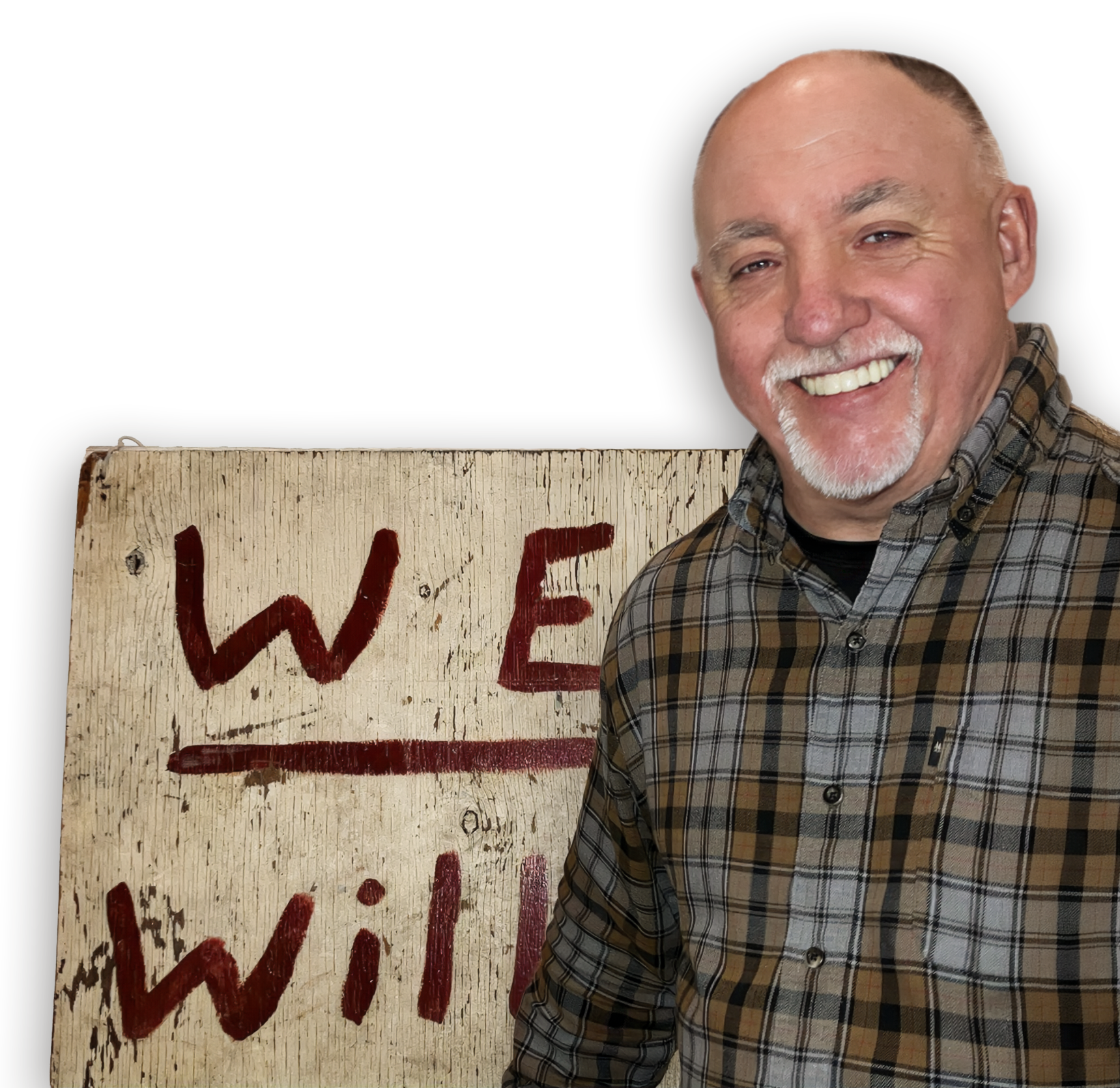 Dan Duddy holding the original WE Will plywood sign
